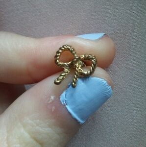 Gold tone ribbon earrings